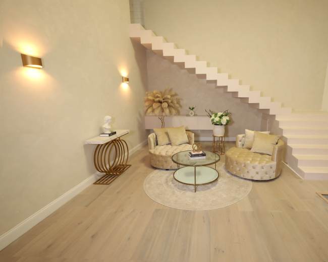 The image shows a modern interior with two tufted chairs, a round glass coffee table, and a staircase leading to an upper level.
