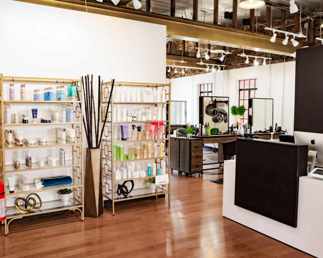 The image shows an interior view of a salon named Hazel, featuring organized shelves of hair and beauty products, a reception desk, and several styling stations.