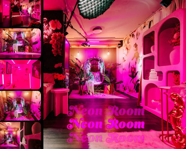 The image displays a vibrant interior known as the "Neon Room," featuring bold pink lighting, floral decorations, and an eclectic design.