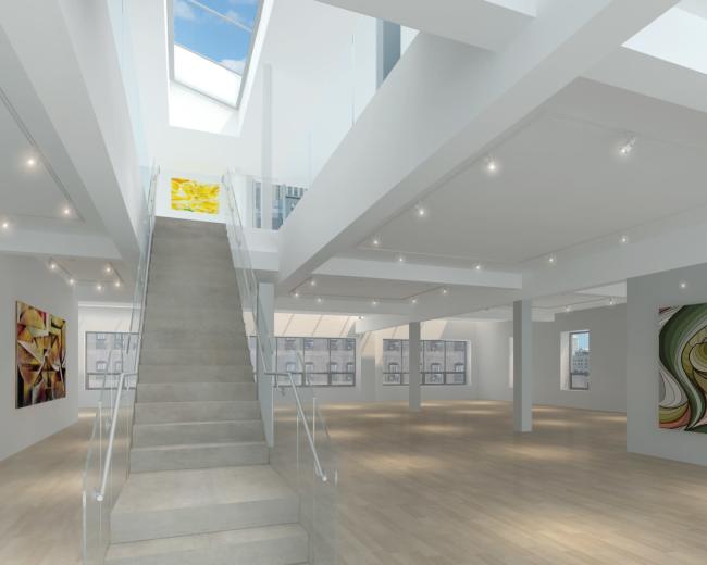 The image shows a spacious, modern art gallery with a staircase leading to a second level and large windows allowing natural light to enter.