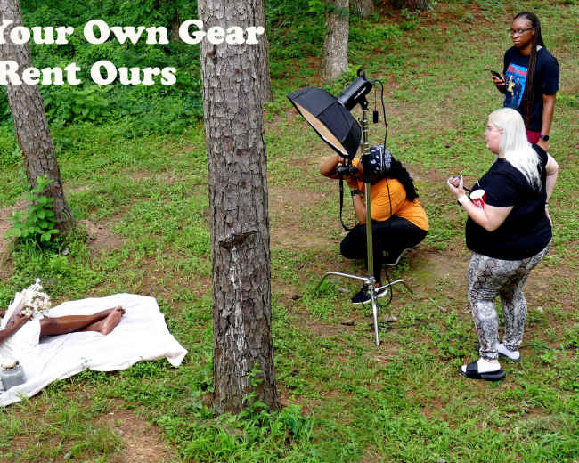 A photoshoot takes place outdoors, featuring a model seated on the ground with a bouquet, while photographers and assistants adjust equipment nearby.