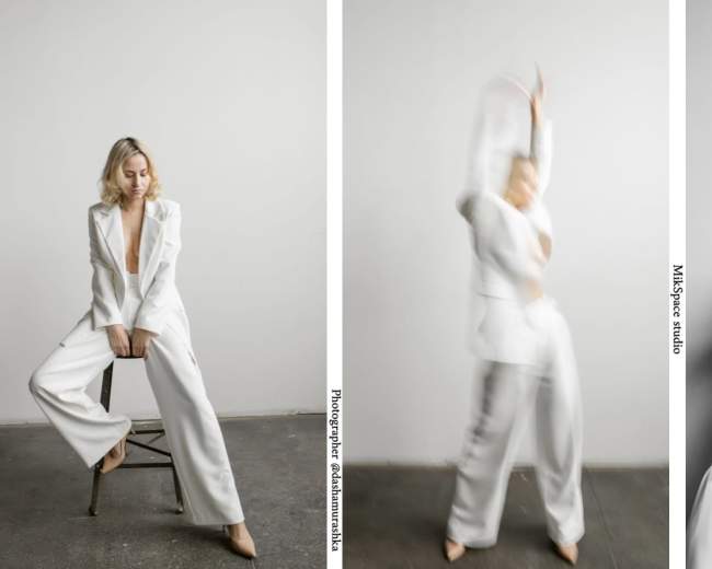 A person wearing a white suit poses in a studio with a minimalist backdrop, showcasing different stances and movements.