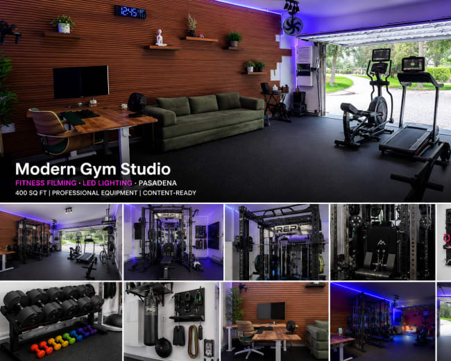 The image showcases a modern gym studio located in a garage, featuring professional fitness equipment, exercise machines, and a wooden accent wall with LED lighting.