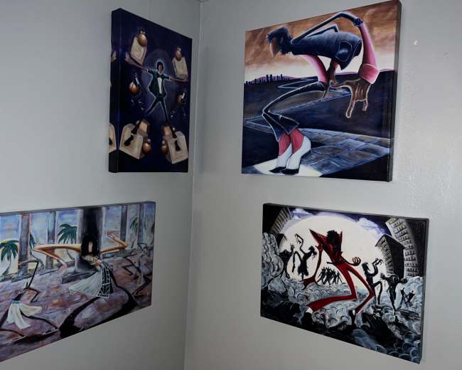 The image features four paintings displayed on a gray wall, arranged in a corner with various themes and styles.