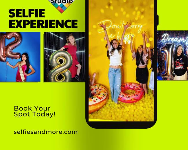 The image promotes a selfie studio experience, featuring a smartphone displaying people posing against a vibrant yellow backdrop with decorative numbers and balloons.
