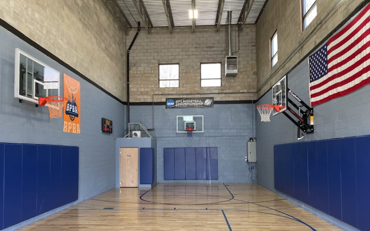 Regulation Sized (half) Indoor Basketball Court. NBA grade wood floors