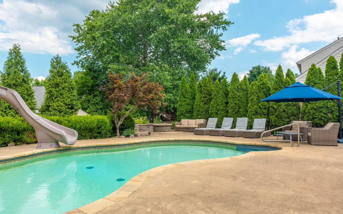 Private pool w/fountains, sunroom, spa, outdoor kitchen, and gardens