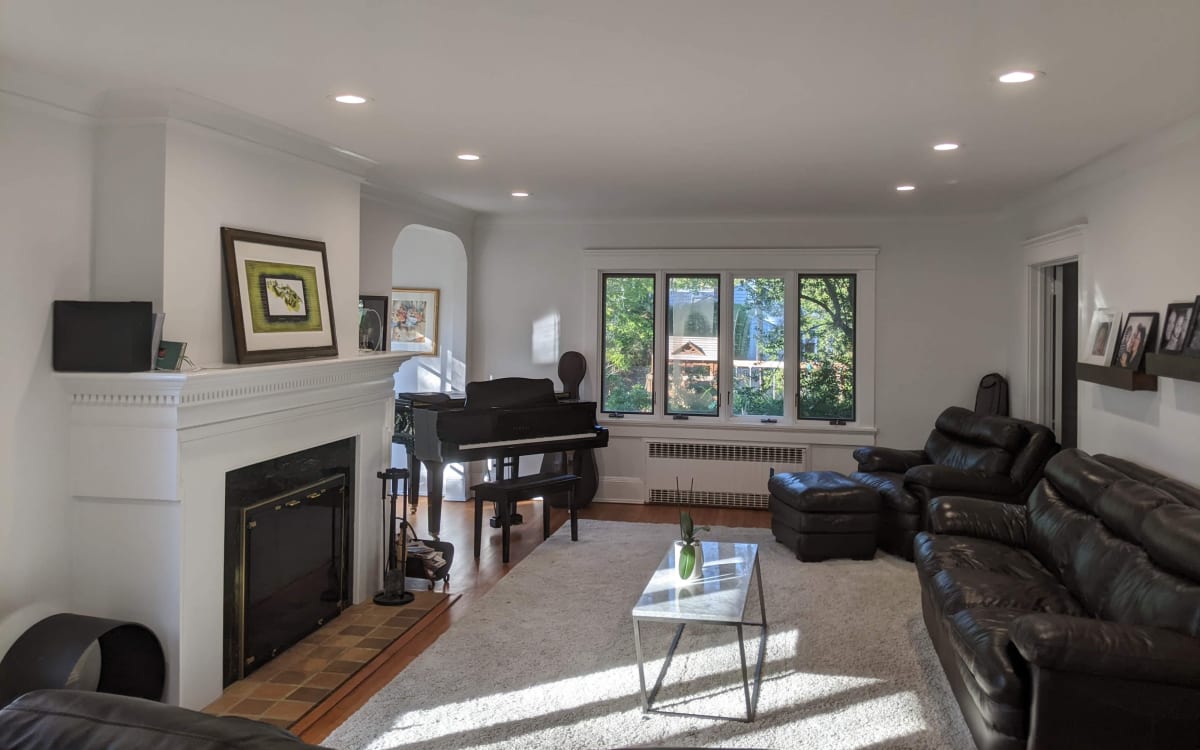 Suburban Tudor Style Home on an Expansive, Lush Property with Sunny, Minimalist Rooms., White