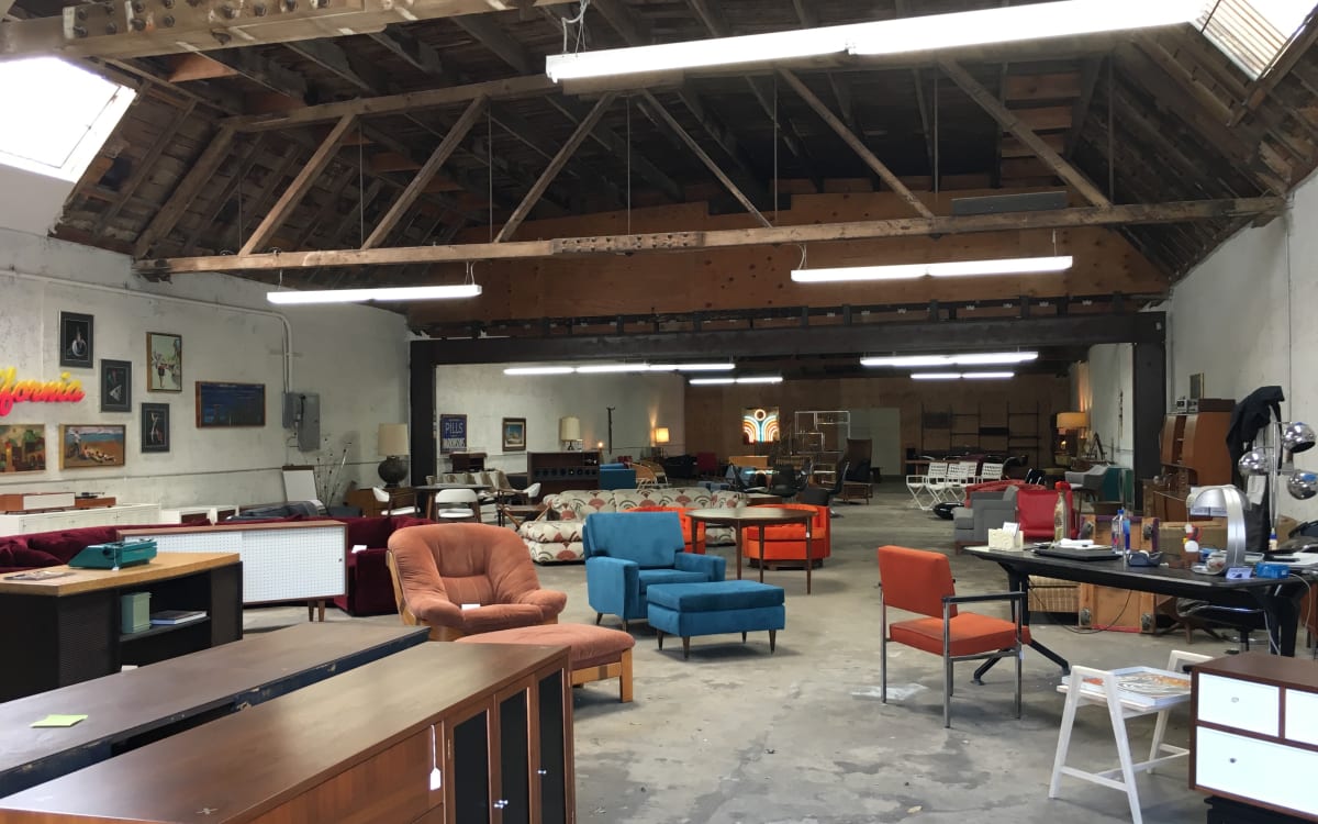 Downtown Industrial Open Bowtruss Warehouse with Vintage Furniture