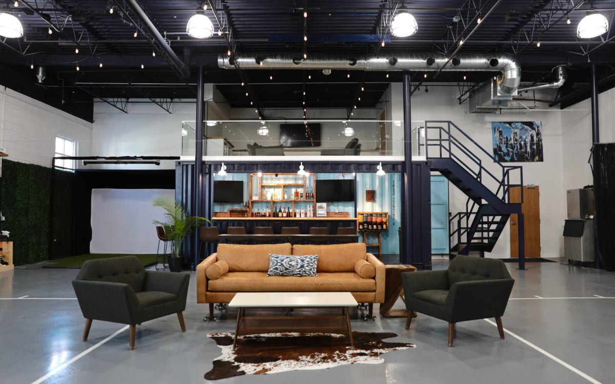 Downtown container bar with basketball court and golf simulator