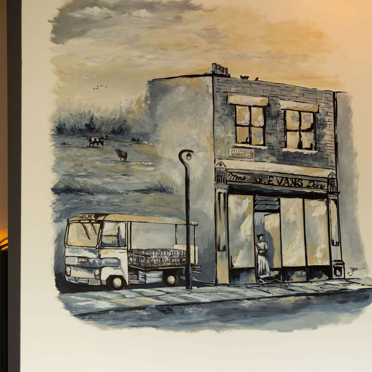 A wall mural of a storefront with a parked truck outside, illustrating a scene of urban life.