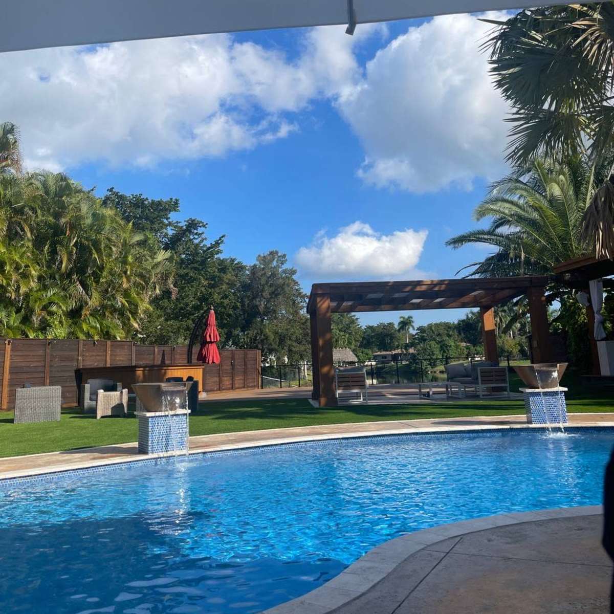 Large, Chic Backyard Space with Heated Pool, Cabanas, TV, Outdoor Kitchen and More in Plantation Image in Plantation, Plantation, FL