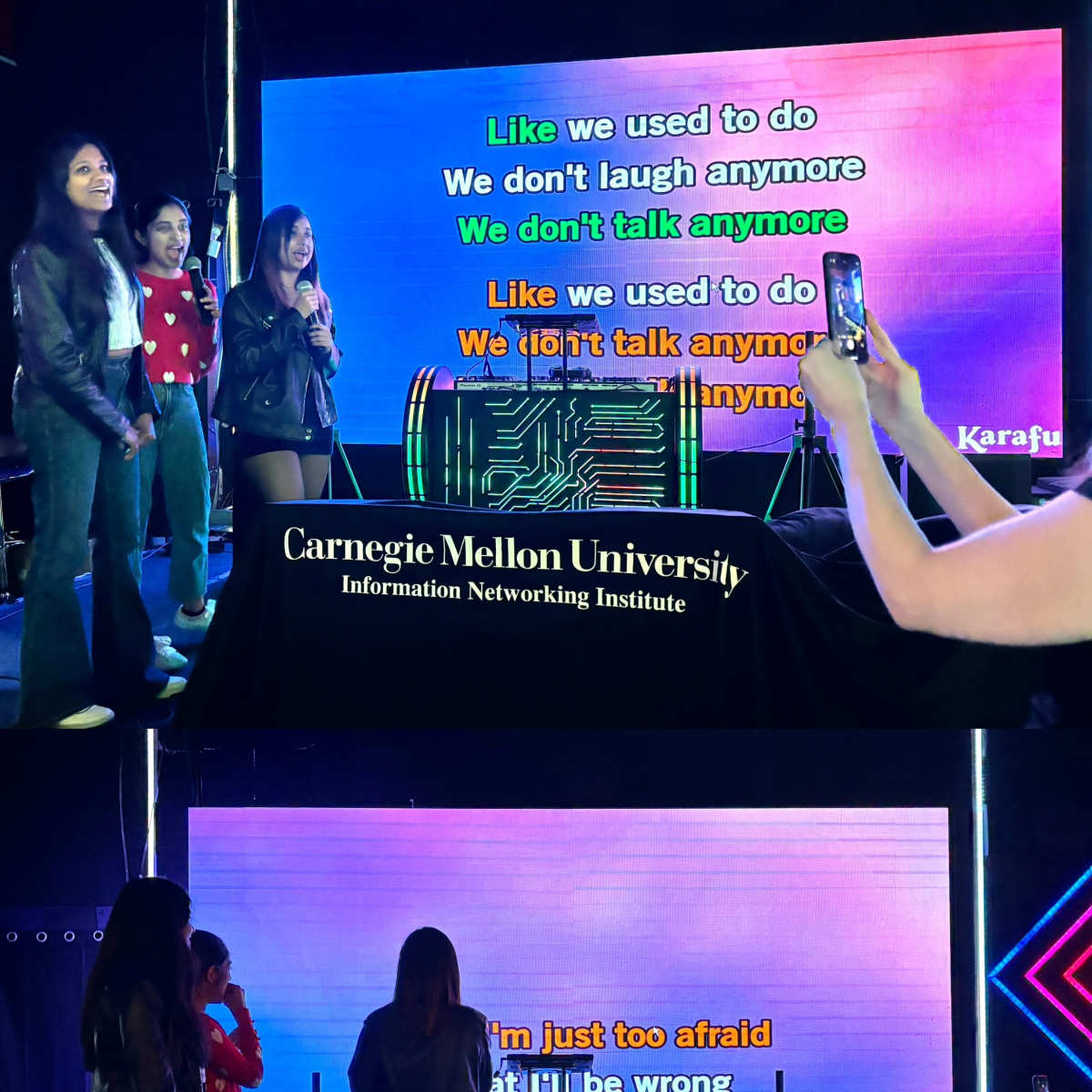 A group of people is singing karaoke in front of a large screen displaying song lyrics at Carnegie Mellon University.