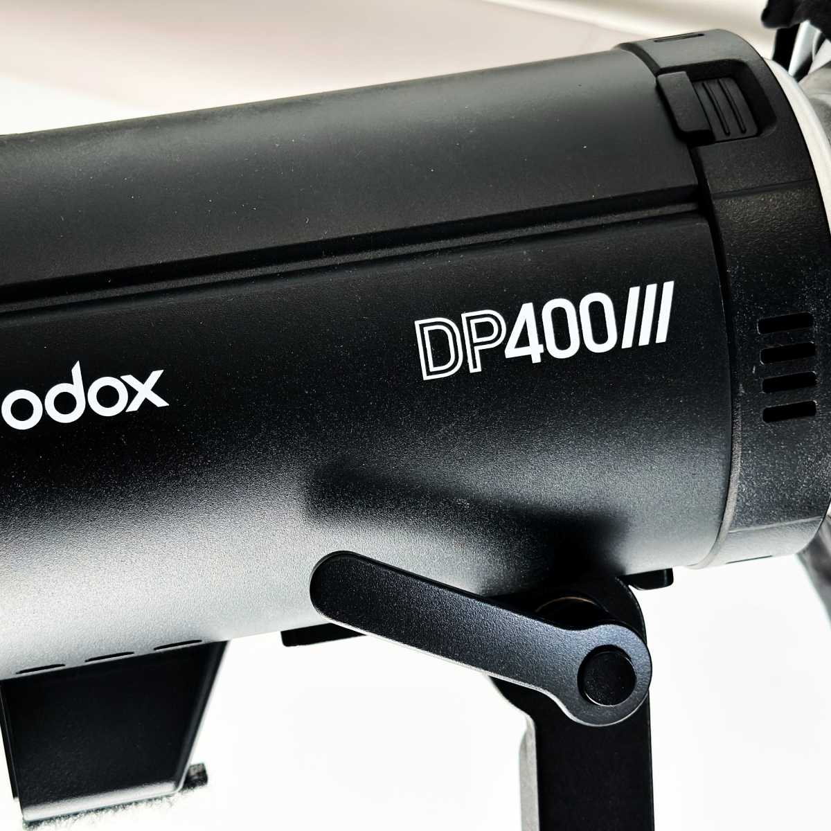 A Godox DP400 III studio flash unit with a sleek black design.