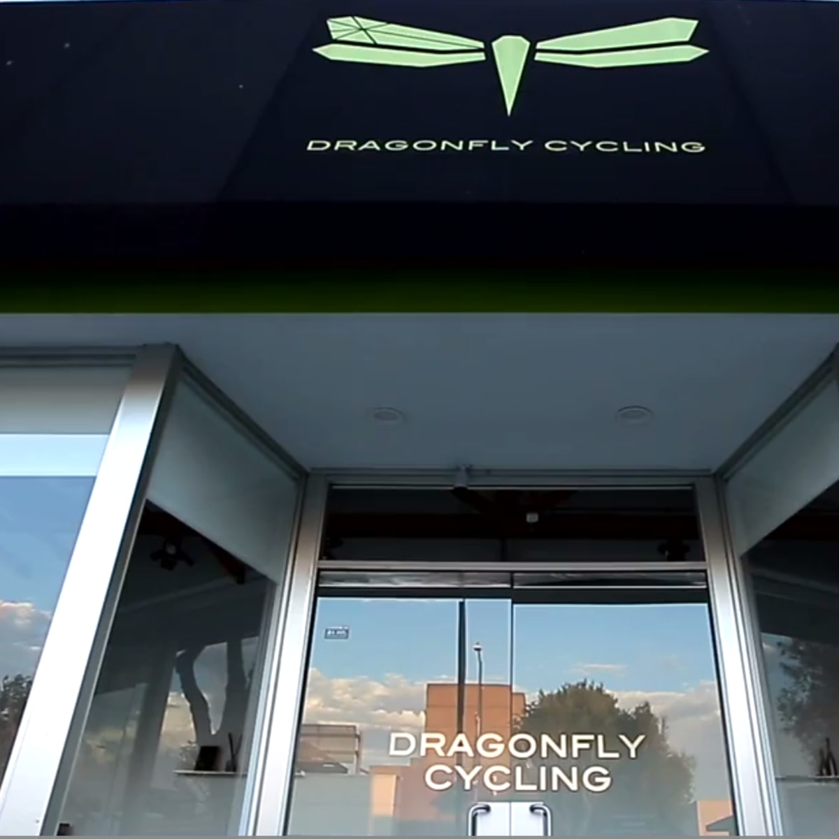 The entrance of a business named "Dragonfly Cycling," featuring a large sign with a dragonfly logo above the glass doors.