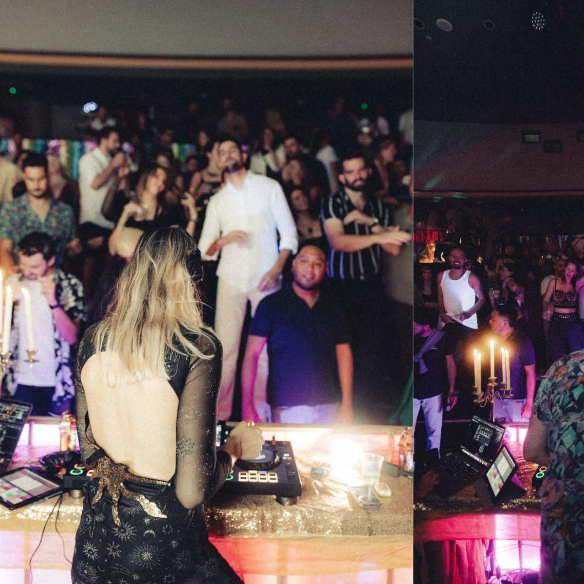 A DJ performs in front of a crowded dance floor, illuminated by colorful lights and surrounded by people dancing.