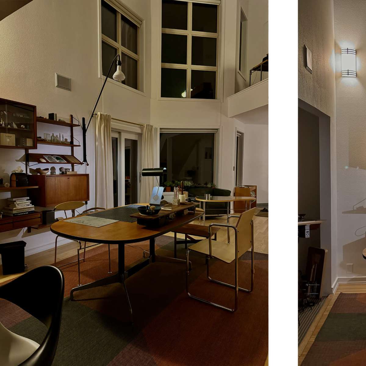 A contemporary home office space featuring a wooden desk and shelves with various items, illuminated by a desk lamp and natural light from large windows.