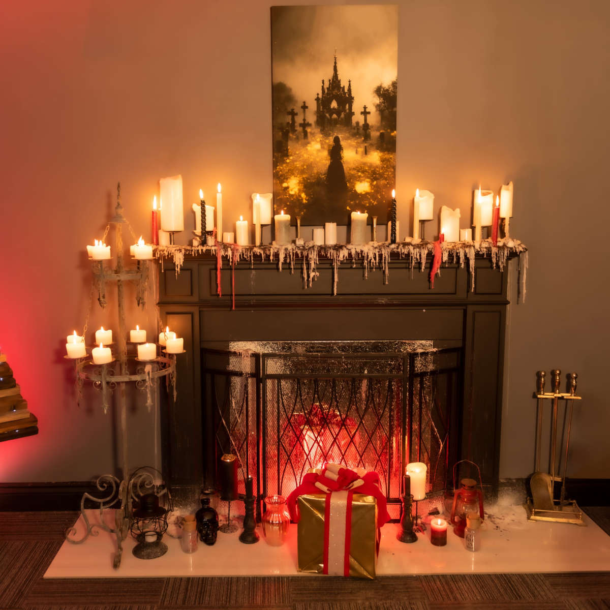 A decorated fireplace features candles, a gift, and a wooden Christmas tree, all set against a backdrop of a misty landscape print.