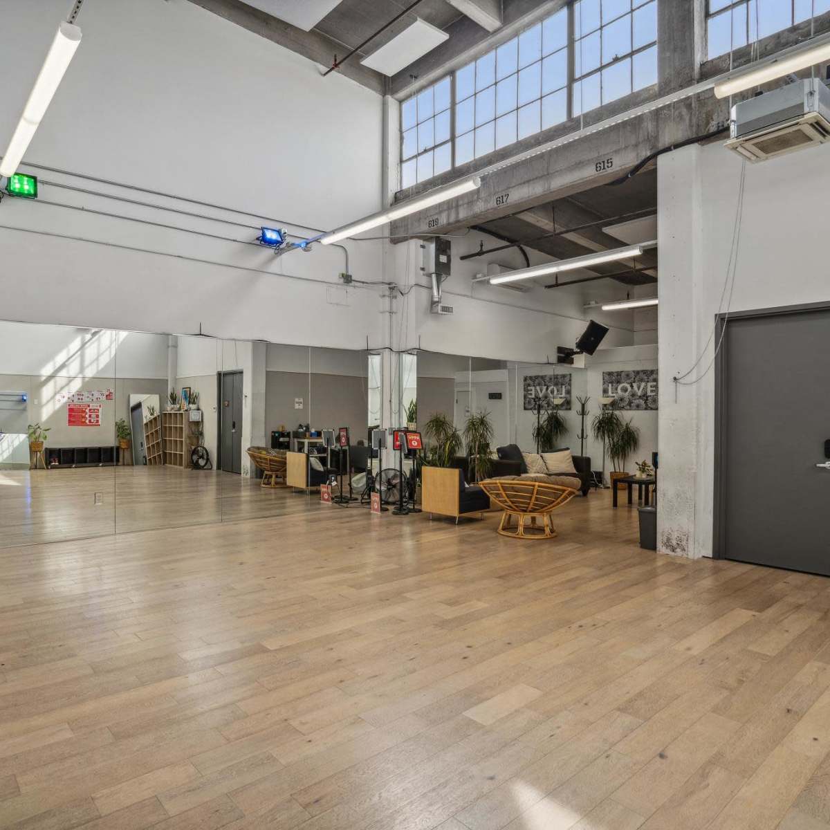 Dynamic dance studio with wall mirrors, sound system, and more ...
