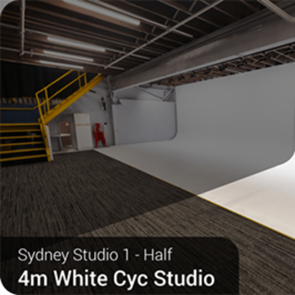 A half section of a 4-meter white cyclorama studio in Sydney, featuring a clean, expansive backdrop and a polished floor.