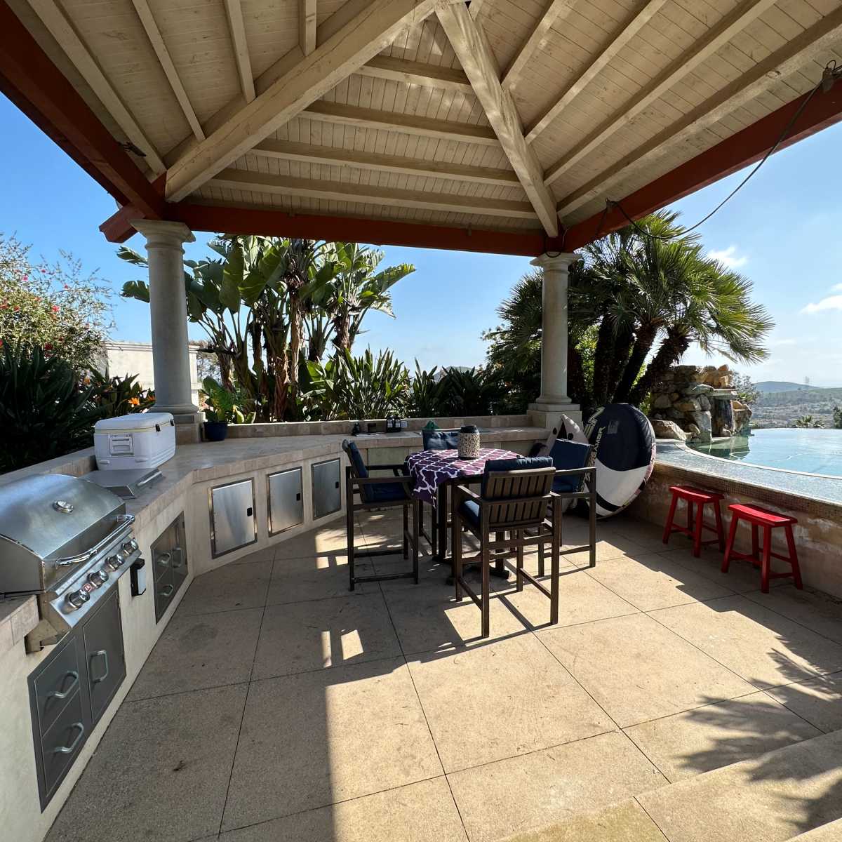 Hilltop Outdoor Pool Lounge with Distant Ocean View in San Marcos Image in , San Marcos, CA