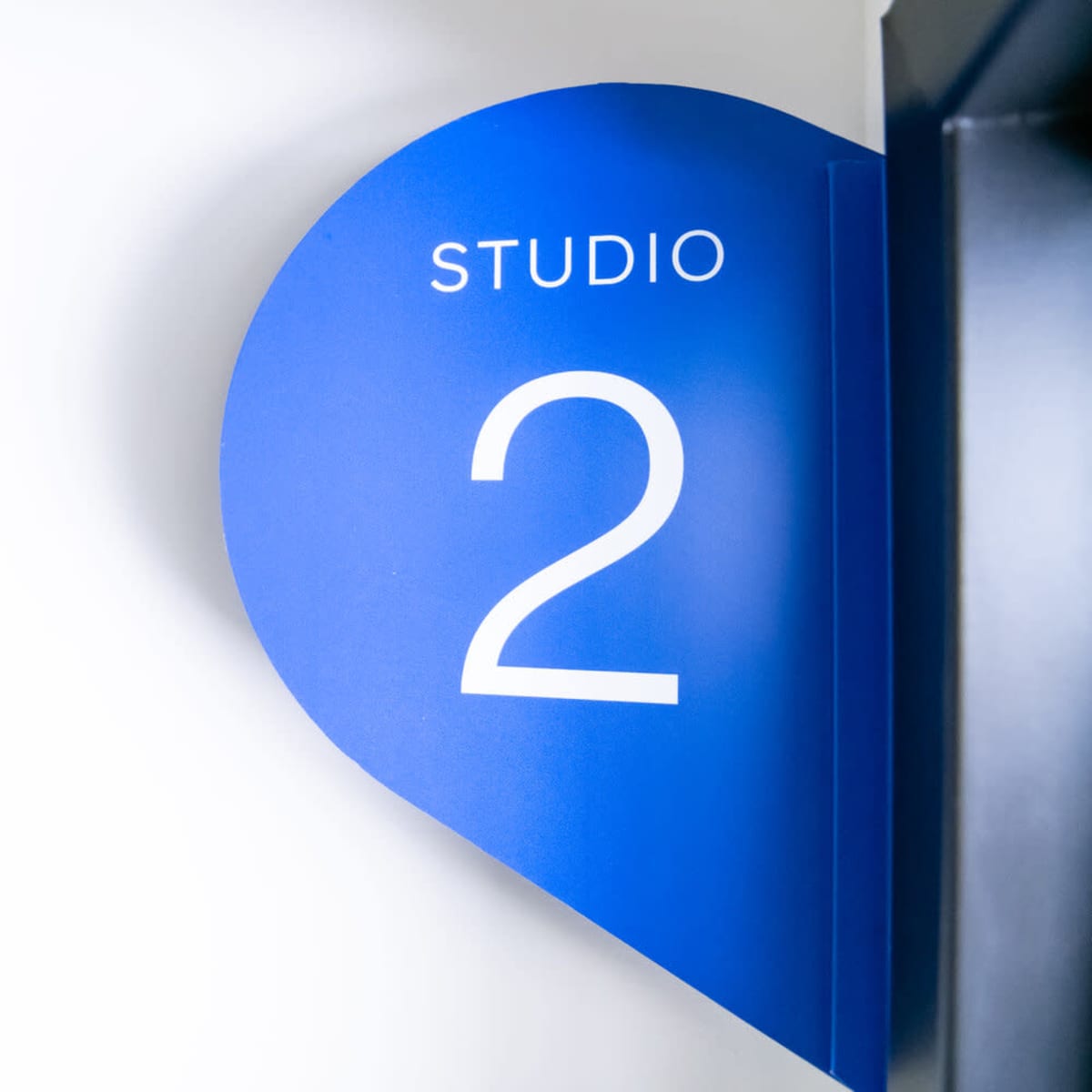 A blue wall sign displays the text "STUDIO 2."