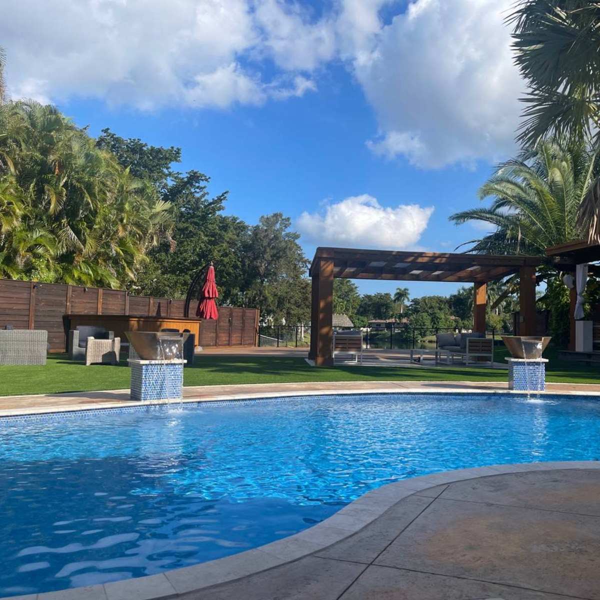 Large, Chic Backyard Space with Heated Pool, Cabanas, TV, Outdoor Kitchen and More in Plantation Image in Plantation, Plantation, FL