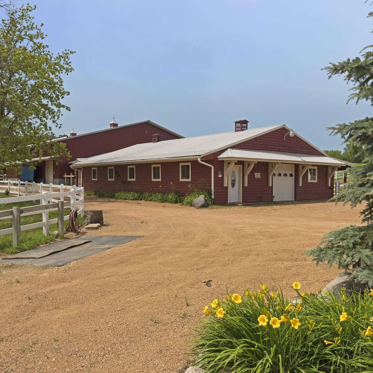 Gorgeous farm property with rolling hills, white fences, plenty of trees, one acre pond, indoor offices/studios/changing rooms, and bathrooms. in Minnetrista Image in Minnetrista, Minnetrista, MN