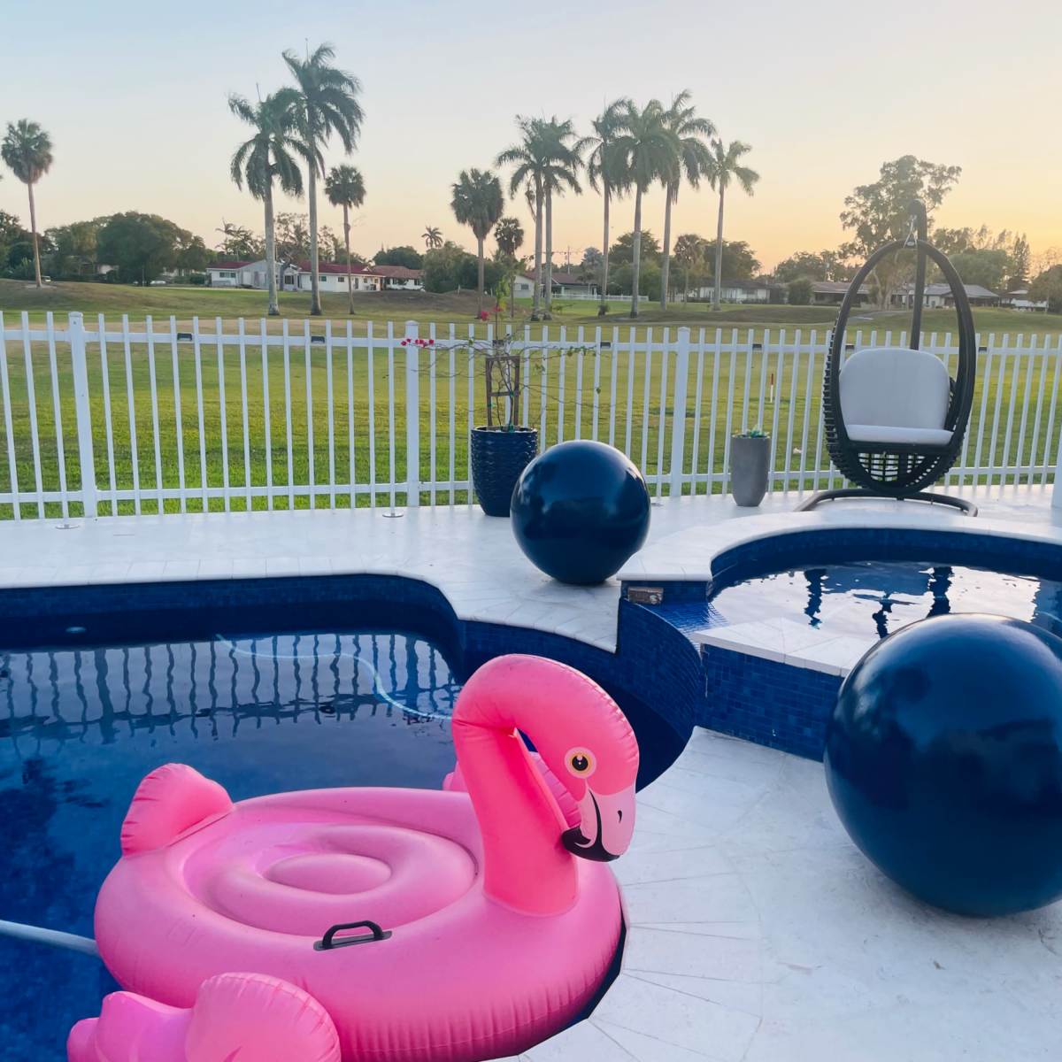 Country club, suburban, outdoor area with pool. Golf course view, roomy area with plenty of seating. in Miami Image in Country Club, Miami, FL