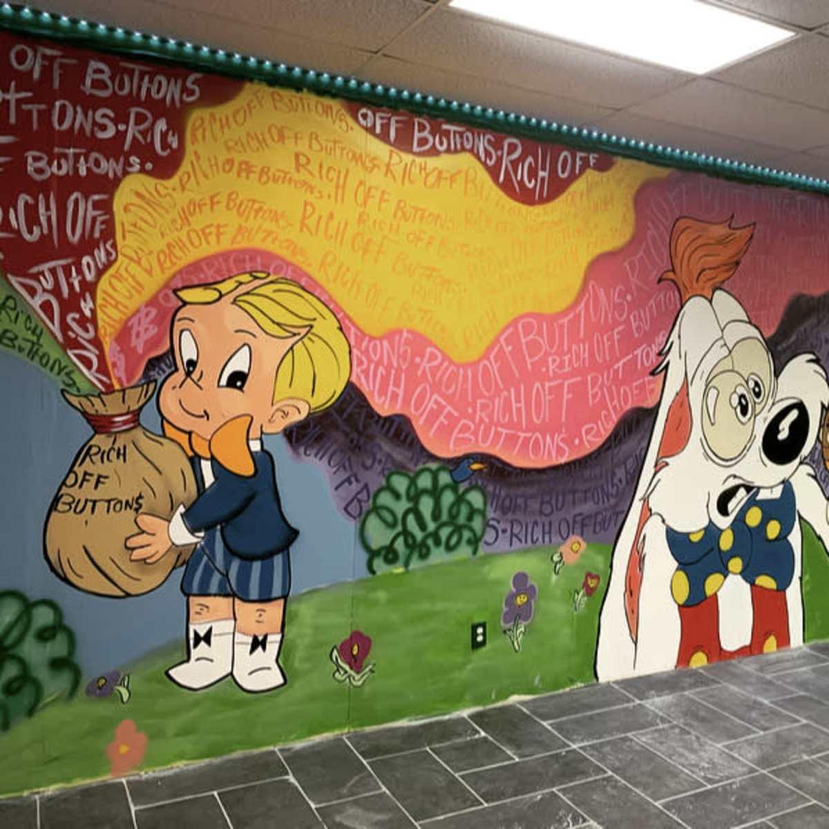 The mural features cartoon characters with one boy holding a bag and a dog sniffing at a sign among colorful painted backgrounds.