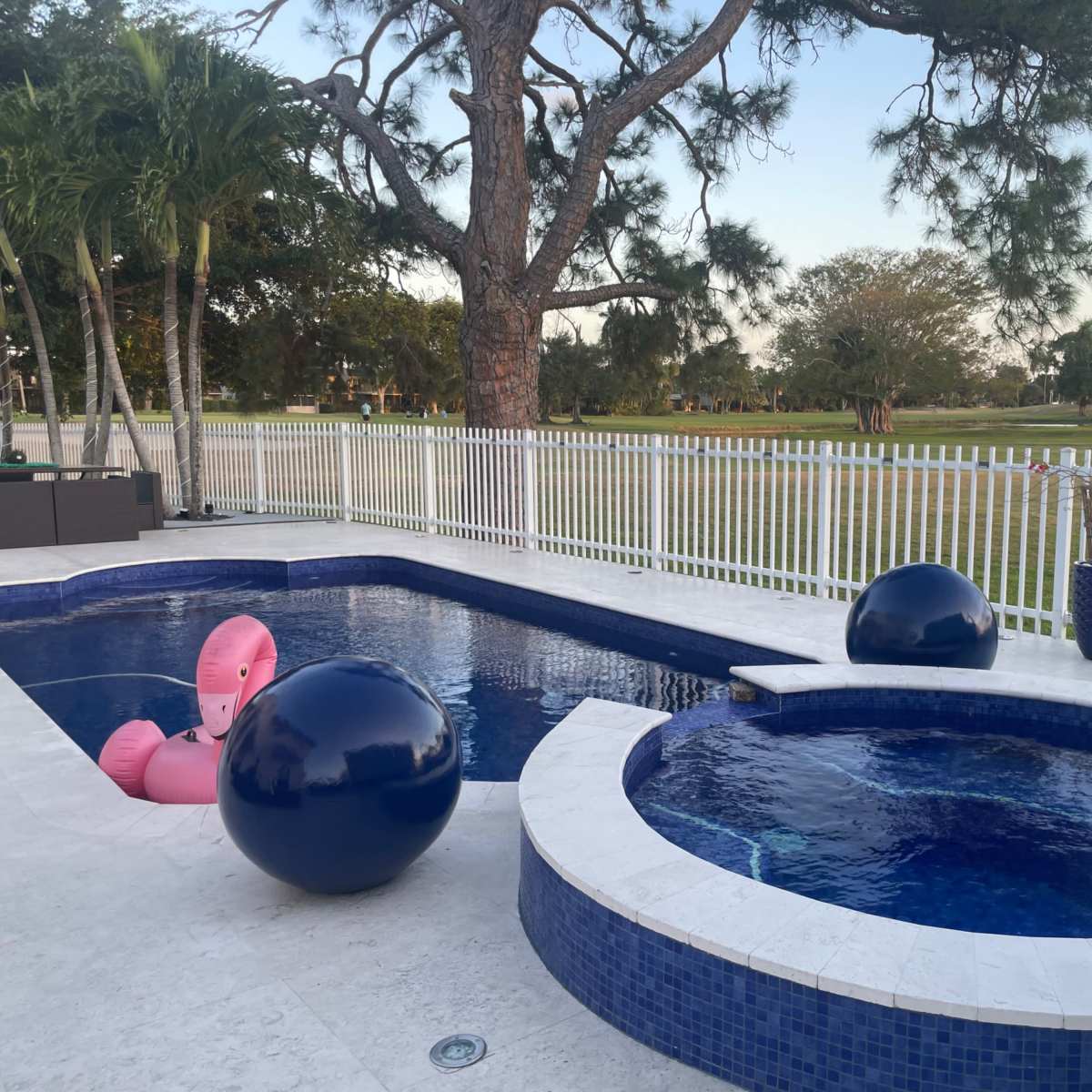 Country club, suburban, outdoor area with pool. Golf course view, roomy area with plenty of seating. in Miami Image in Country Club, Miami, FL