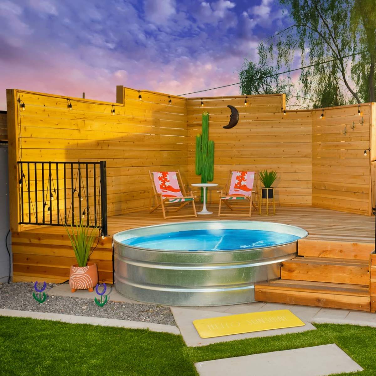 A wooden deck featuring a circular above-ground pool, surrounded by planters and chairs, with a sunset sky in the background.