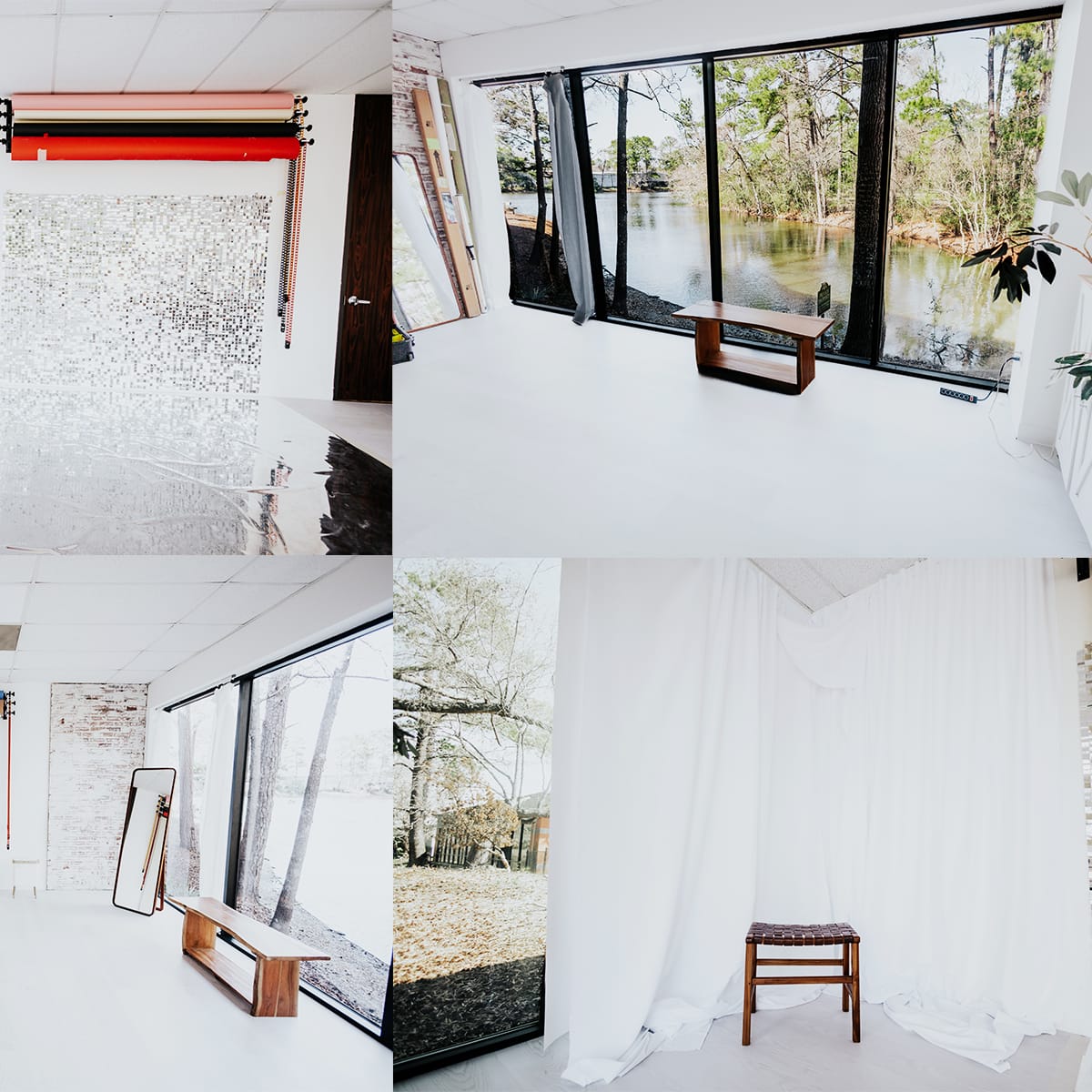 A bright, minimalist interior space featuring large windows with a view of water, a small wooden chair, and various backdrops on the walls.