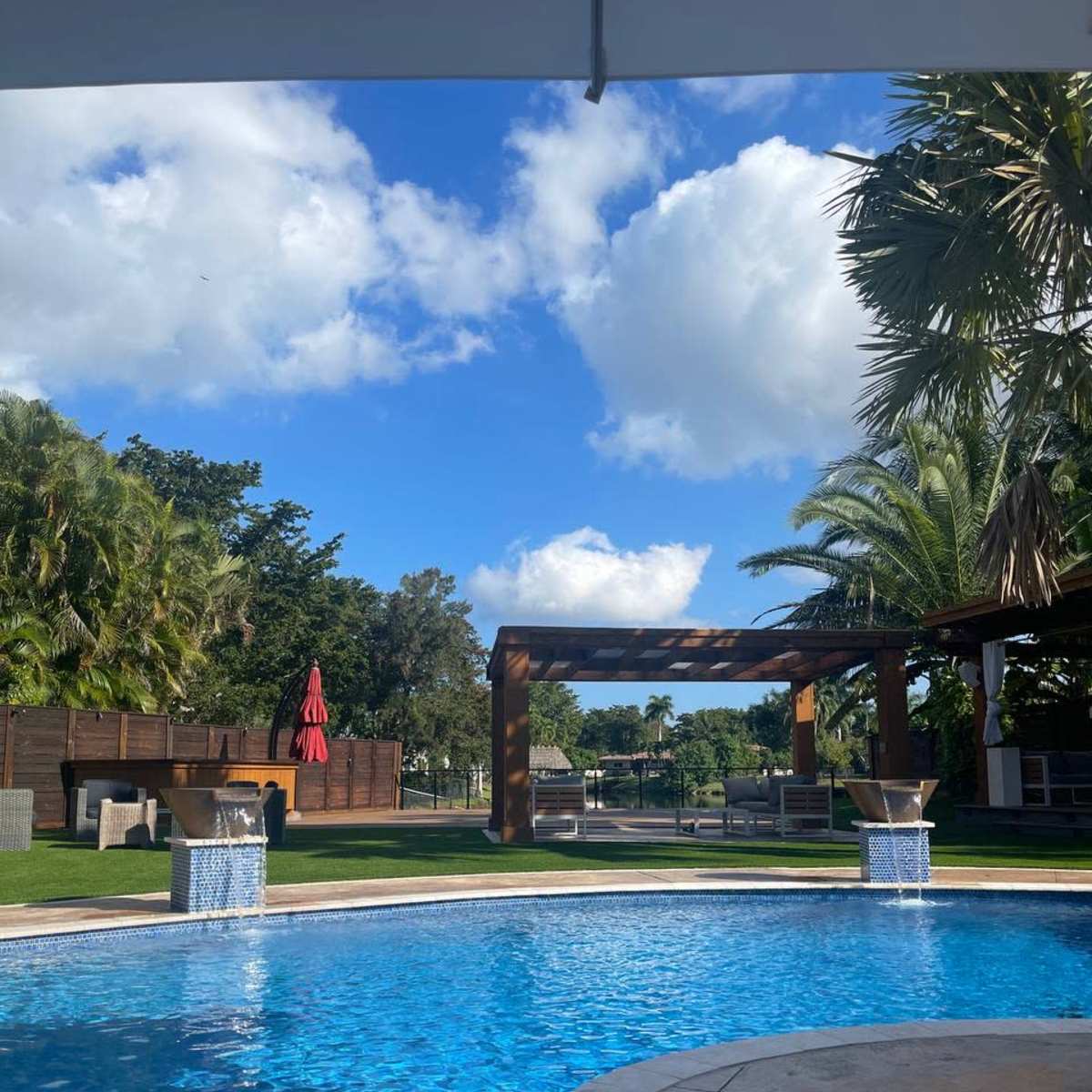 Large, Chic Backyard Space with Heated Pool, Cabanas, TV, Outdoor Kitchen and More in Plantation Image in Plantation, Plantation, FL