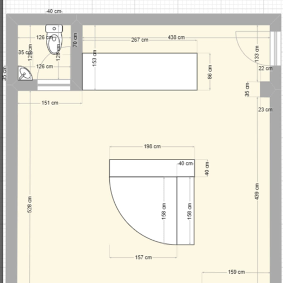 A floor plan of a room with dimensions for various areas including a toilet, sink, and a central space.
