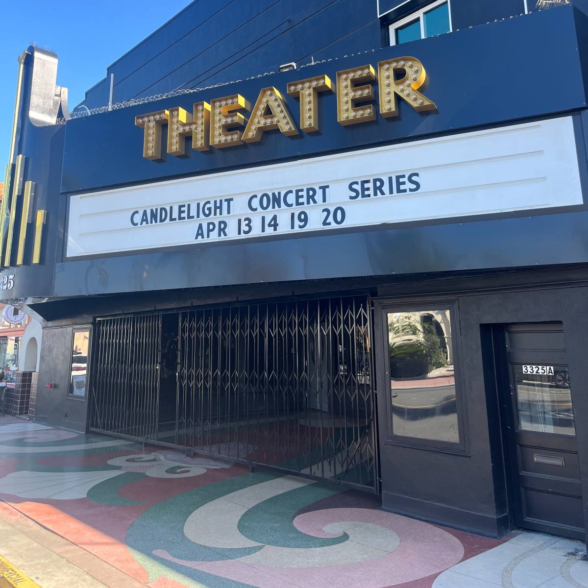 A theater marquee displays the words "CANDLELIGHT CONCERT SERIES" along with dates "APR 13 14 19 20."