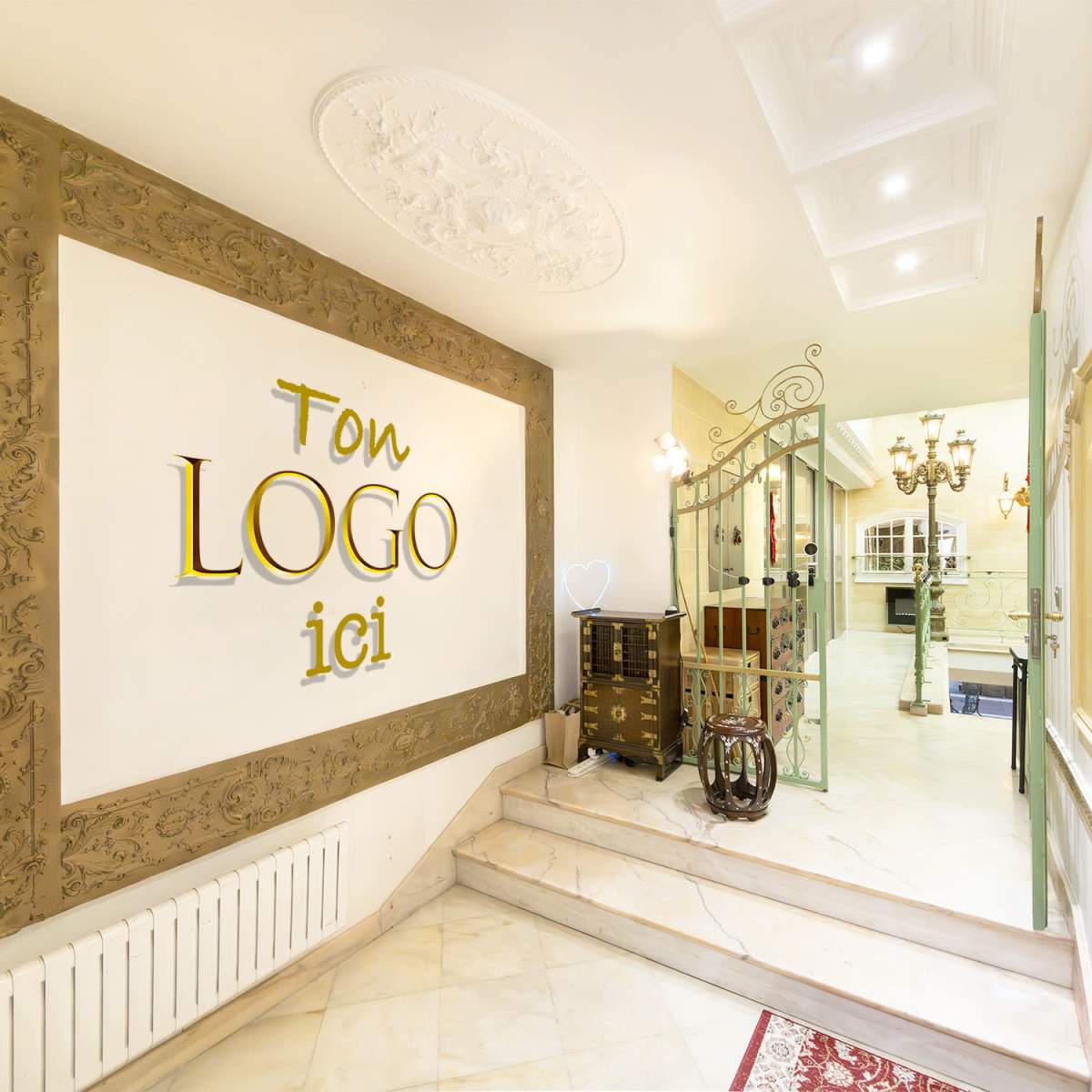 An elegant entrance hall with a decorative wall featuring the words "Ton LOGO ici," along with a staircase leading to another area and ornate light fixtures in the background.
