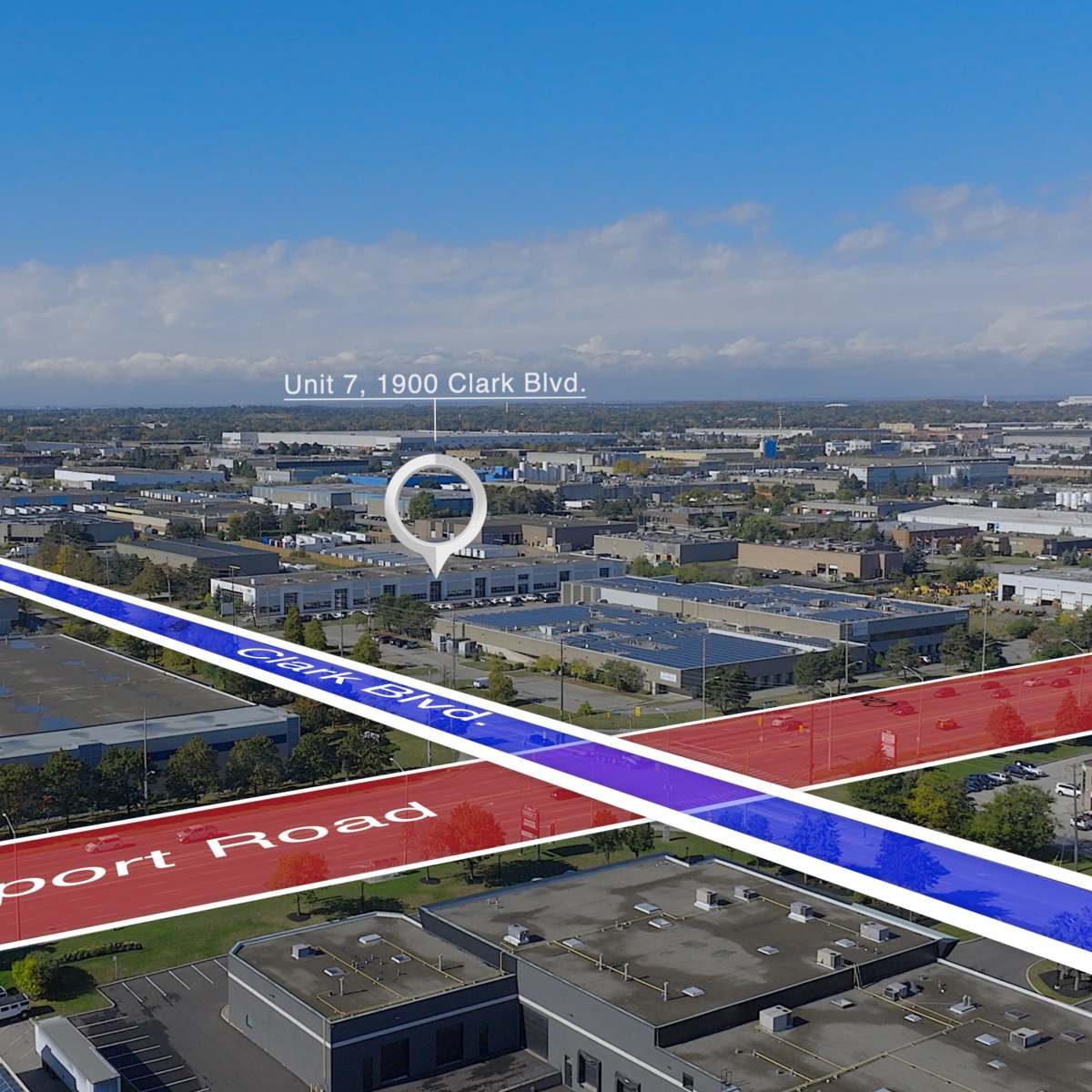 An aerial view of a commercial area with roads labeled Airport Road and Clark Boulevard, along with a marker indicating "Unit 7, 1900 Clark Blvd."
