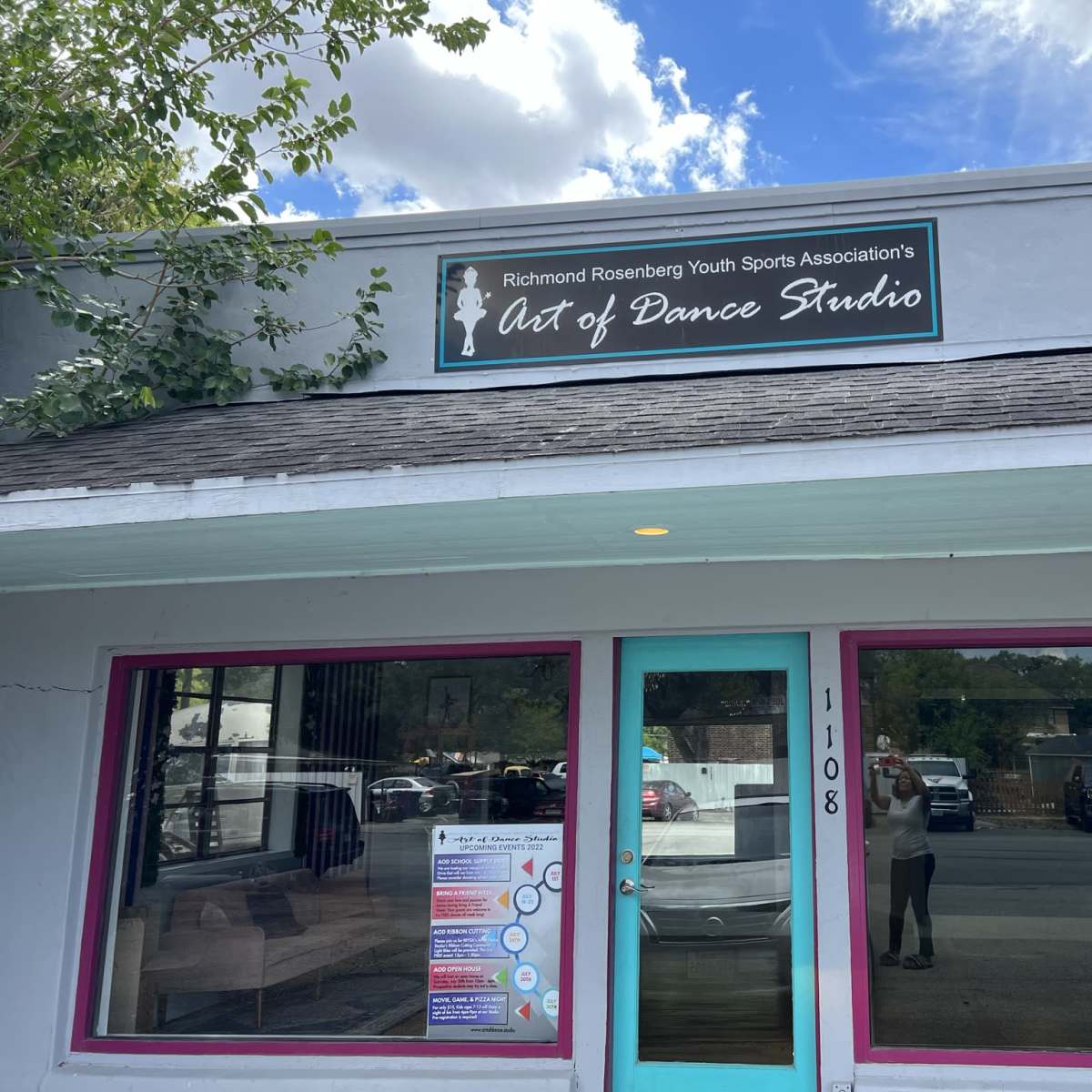 The exterior of the Art of Dance Studio, a building with a sign and a bright-colored trim, located at 1108.