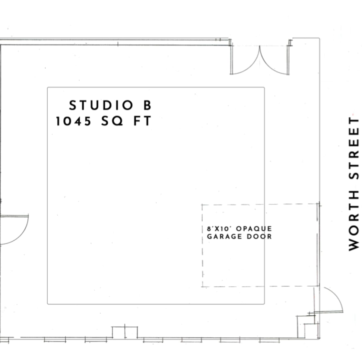A floor plan of Studio B, measuring 1,045 square feet, with a rest room and an opaque garage door located at the bottom right.