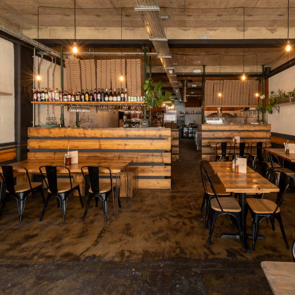 Rustic pizza restaurant with high exposed beam ceilings. in London Image in London, London, ENG