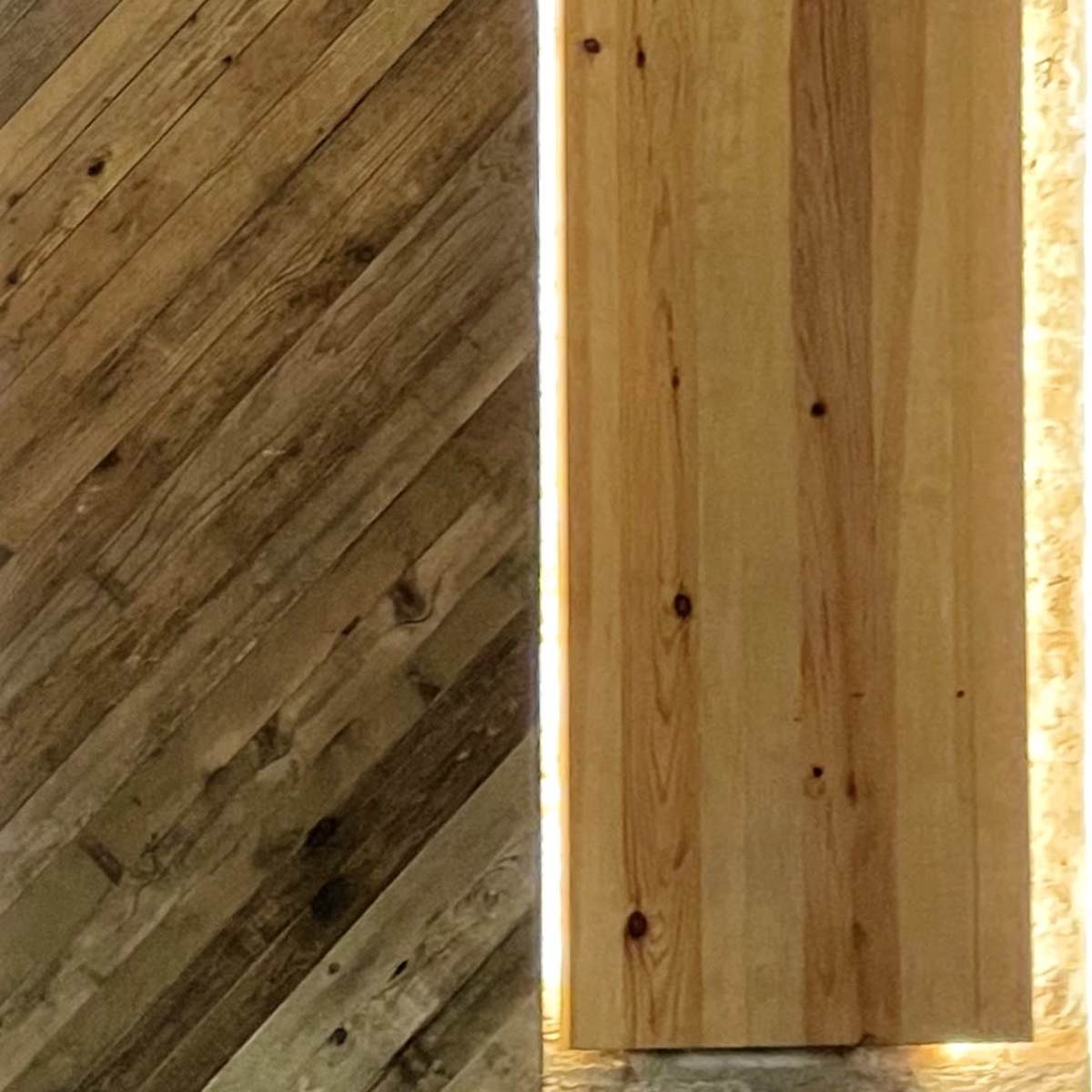 Two wooden panels, one with a diagonal pattern and a textured finish, and the other a smooth, vertically oriented door illuminated by light around its edges.