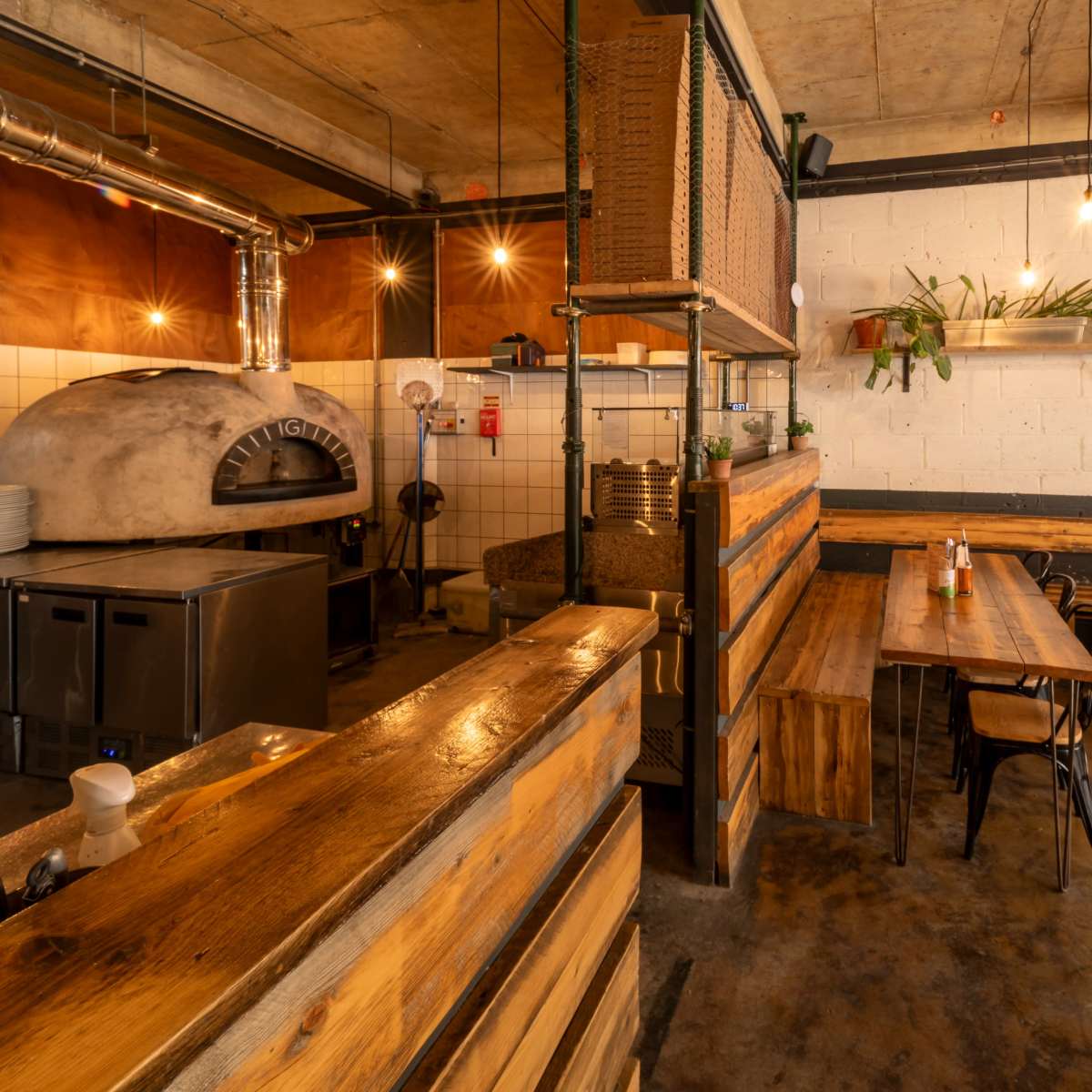 Rustic pizza restaurant with high exposed beam ceilings. in London Image in London, London, ENG