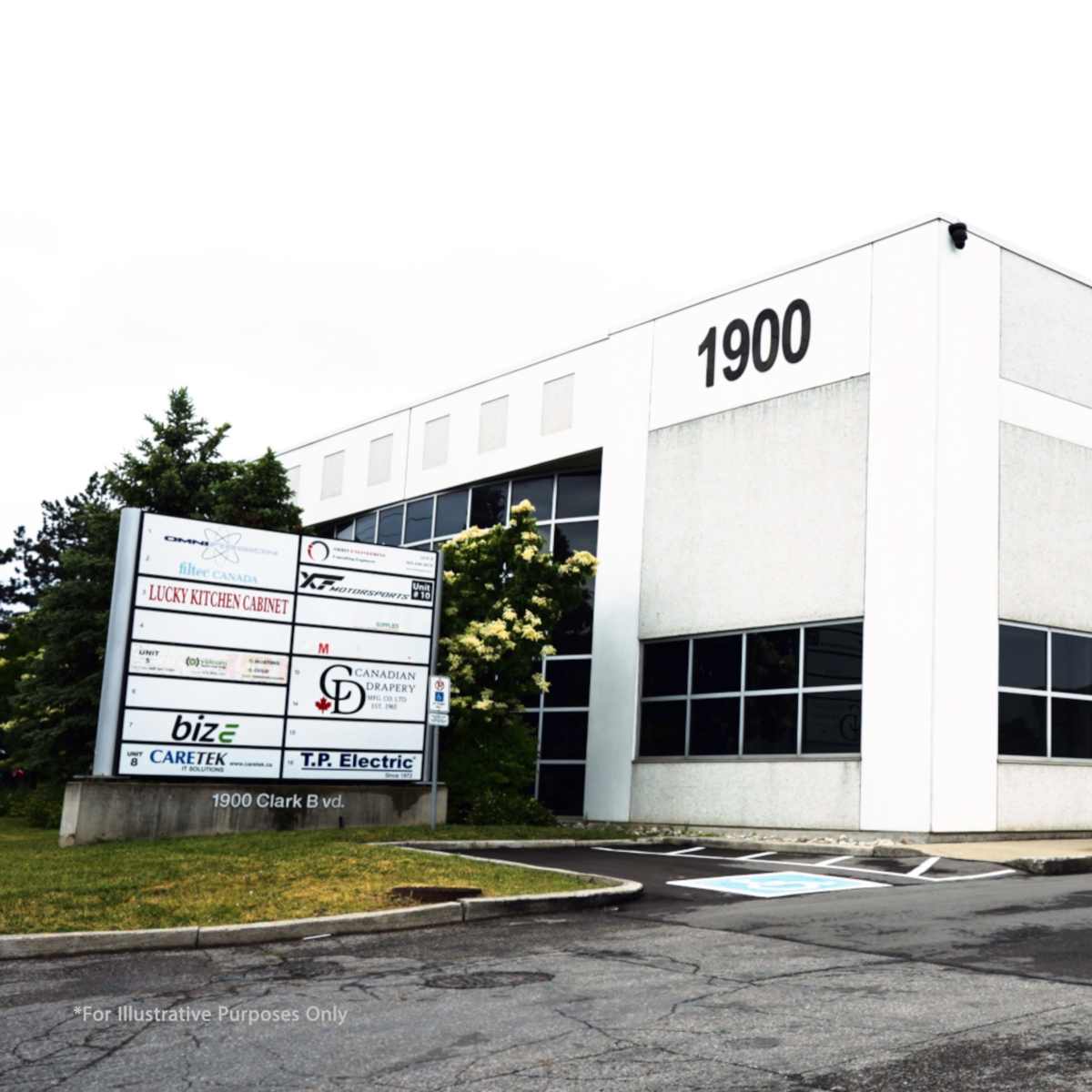 A modern commercial building with a prominent address of 1900 and a sign displaying multiple business names.