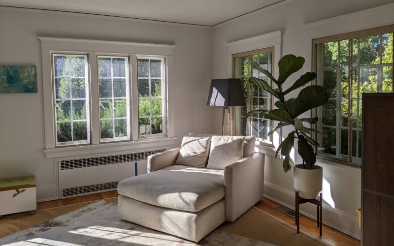 Suburban Tudor Style Home on an Expansive, Lush Property with Sunny, Minimalist Rooms., White