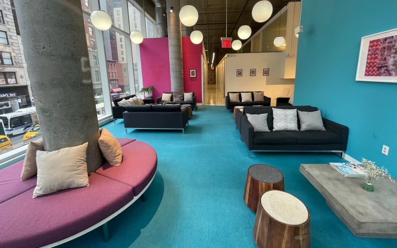 Stylish midtown lounge with floor to ceiling windows, New York, NY