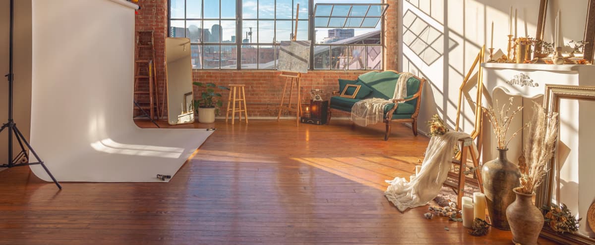 Natural Light Studio Loft with Brick Walls, Piano, and a Fireplace for Photo & Video in Dallas Hero Image in Deep Ellum, Dallas, TX