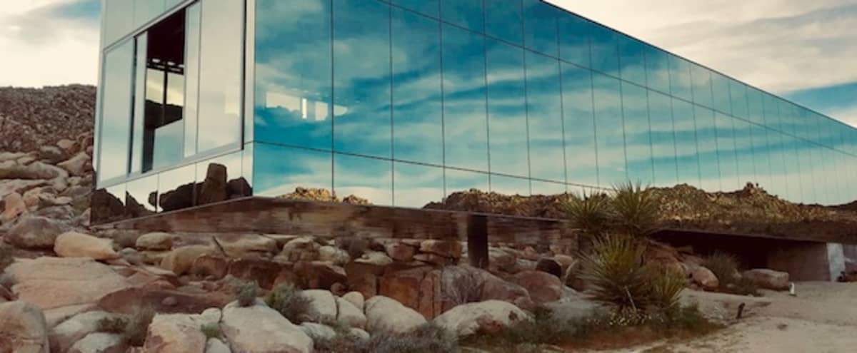 Invisible House mirrored nestled in 90 acres of rocks like another planet sci fi beyond in Joshua Tree Hero Image in undefined, Joshua Tree, CA