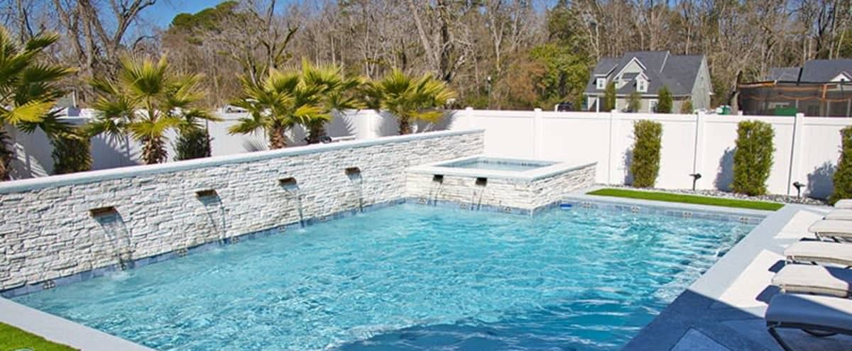 Outdoor Palm Spring Vacation Pool Deck with Hot Tub Jacuzzi in Thomasville Hero Image in undefined, Thomasville, GA