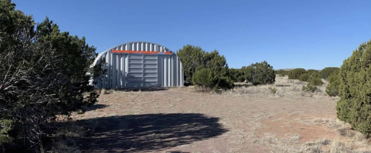 Isolated desert land with massive Quonset hut. in Magdalena Hero Image in undefined, Magdalena, NM